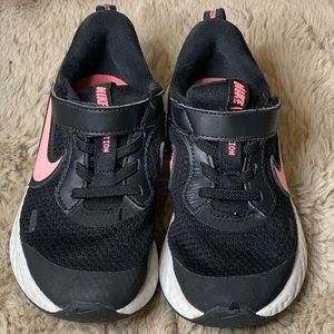 Pink and black Nike shoes